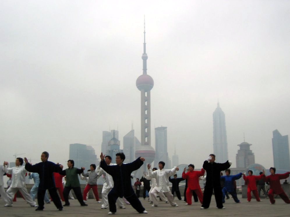 Tai Chi practice outdoors—slow, balanced movement with coordinated breathing